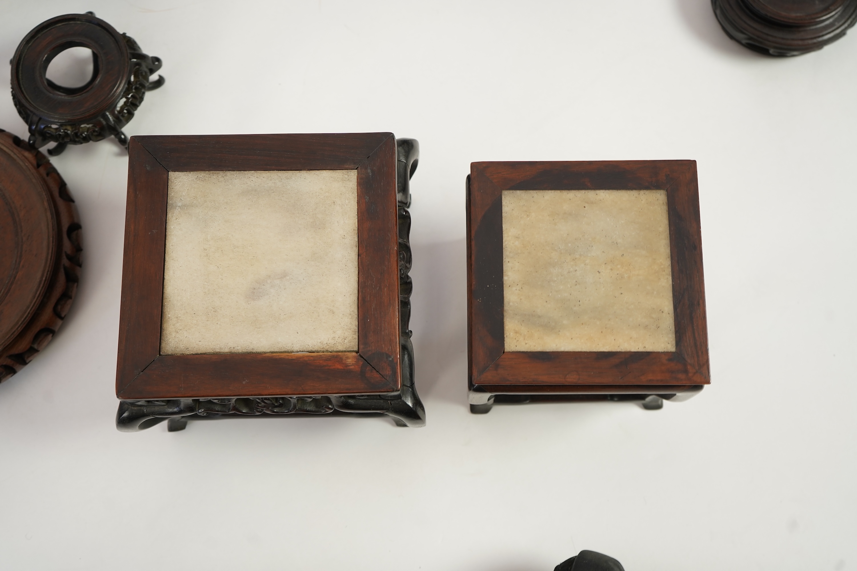 A group of sixteen Chinese hardwood stands together with a Japanese stand, 19th/20th century